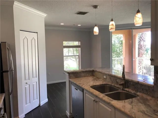 a kitchen with a sink and a window