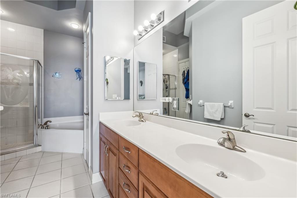 2797 First Street, Unit 2003 Fort Myers, FL 33916 - Photo 19 of 39 a bathroom with a sink a toilet and shower