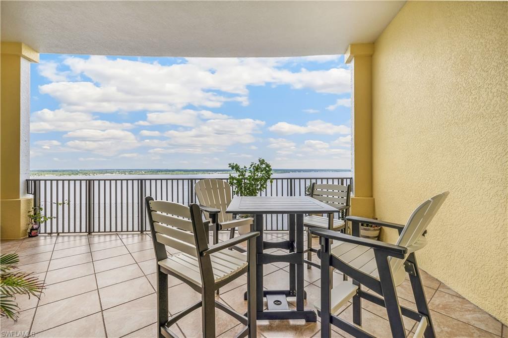 2797 First Street, Unit 2003 Fort Myers, FL 33916 - Photo 23 of 39 a view of a balcony with chair and table