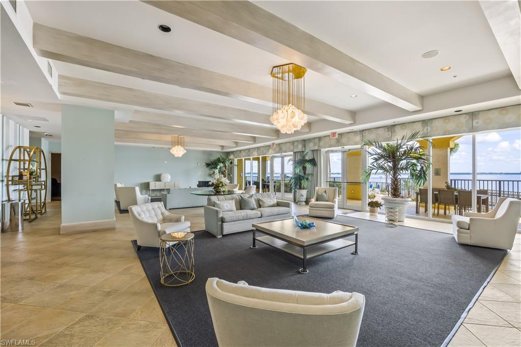 2797 First Street, Unit 2003 Fort Myers, FL 33916 - Photo 29 of 39 a living room with furniture and a large window