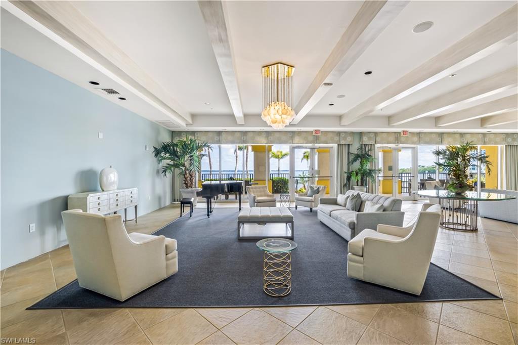 2797 First Street, Unit 2003 Fort Myers, FL 33916 - Photo 30 of 39 a living room with couches and a large window with garden view
