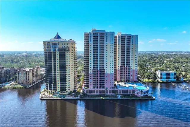 a view of a lake with tall buildings