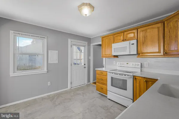 a kitchen with stainless steel appliances granite countertop a stove and a sink