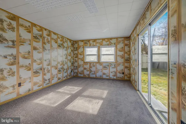 a view of an empty room and window