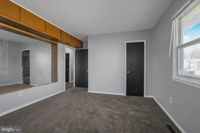 a view of a kitchen from the hallway