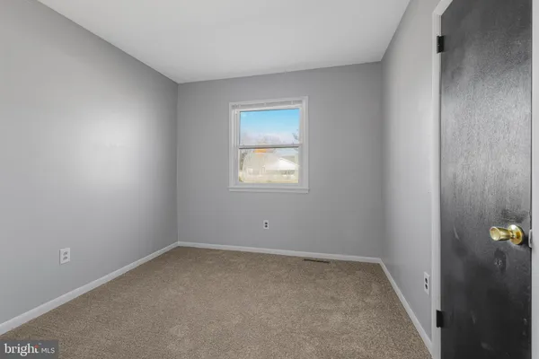 a bathroom with a sink mirror and toilet