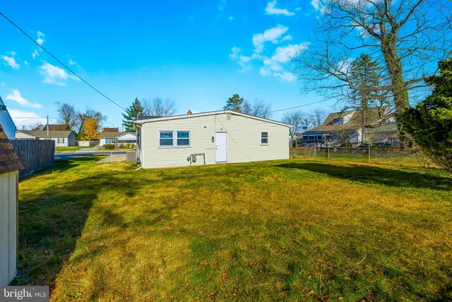 a view of a swimming pool with an outdoor space and seating area