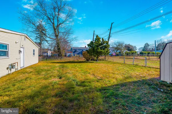 a view of a house with swimming pool and a yard