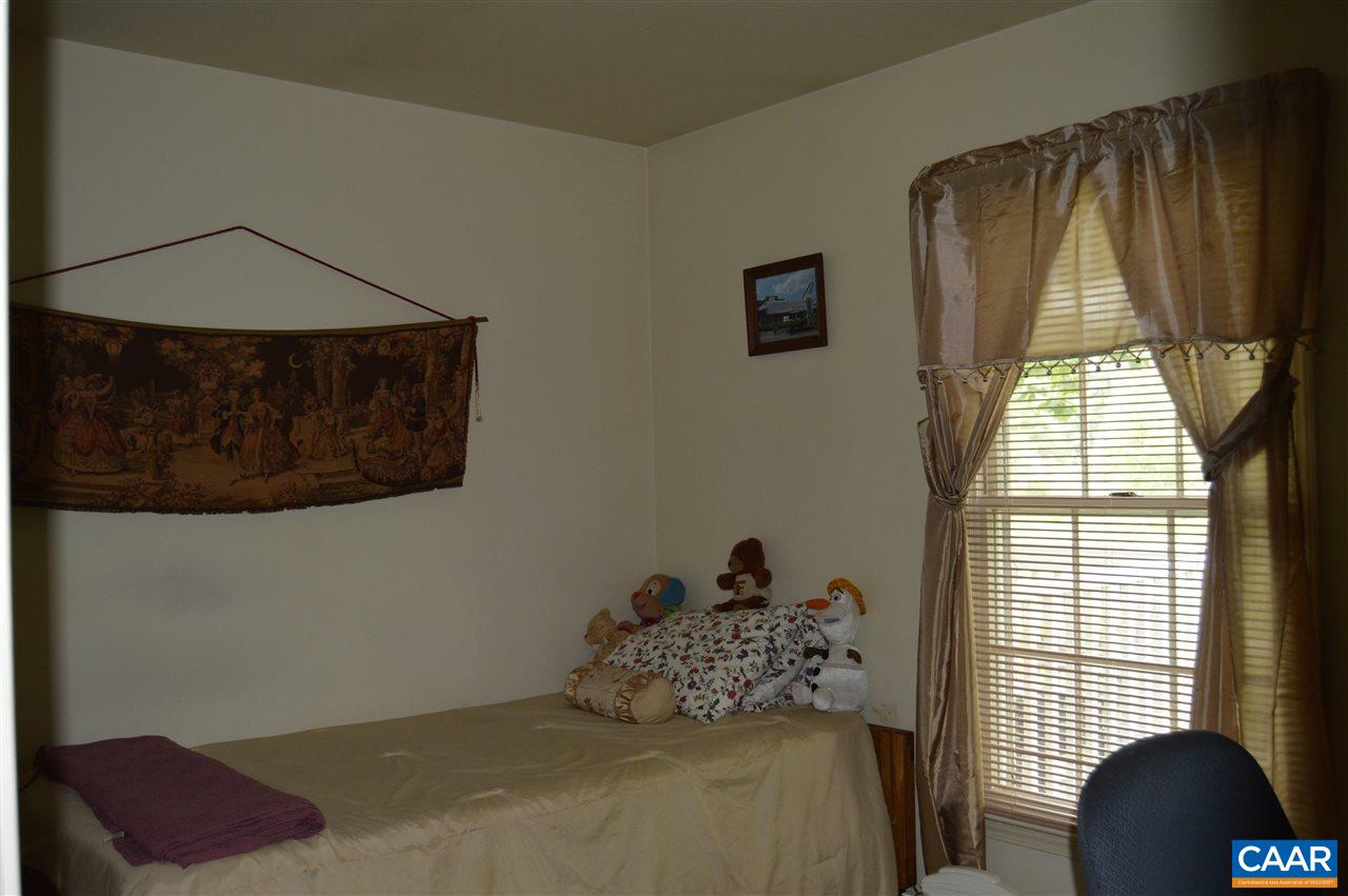 92 Rippin Run Road Ruckersville, VA 22968 - Photo 13 of 17 a bedroom with a bed and a window