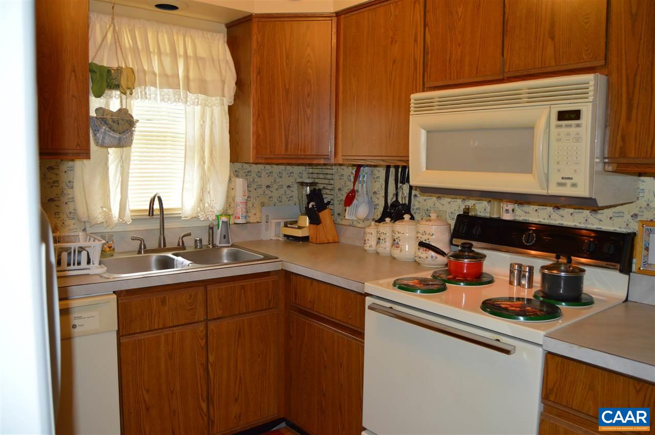 92 Rippin Run Road Ruckersville, VA 22968 - Photo 3 of 17 a kitchen with a sink cabinets and window