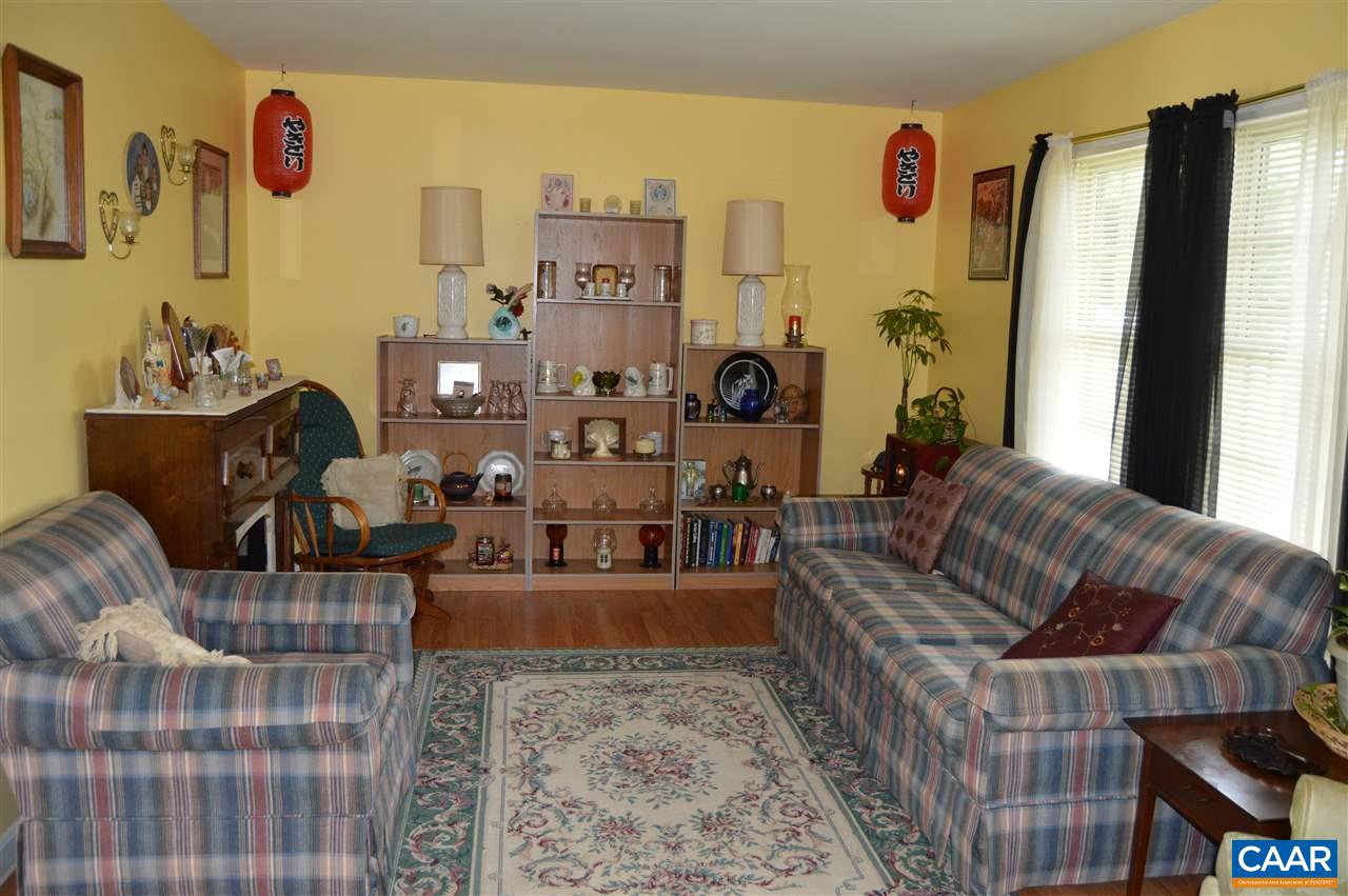 92 Rippin Run Road Ruckersville, VA 22968 - Photo 4 of 17 a living room with furniture and a flat screen tv