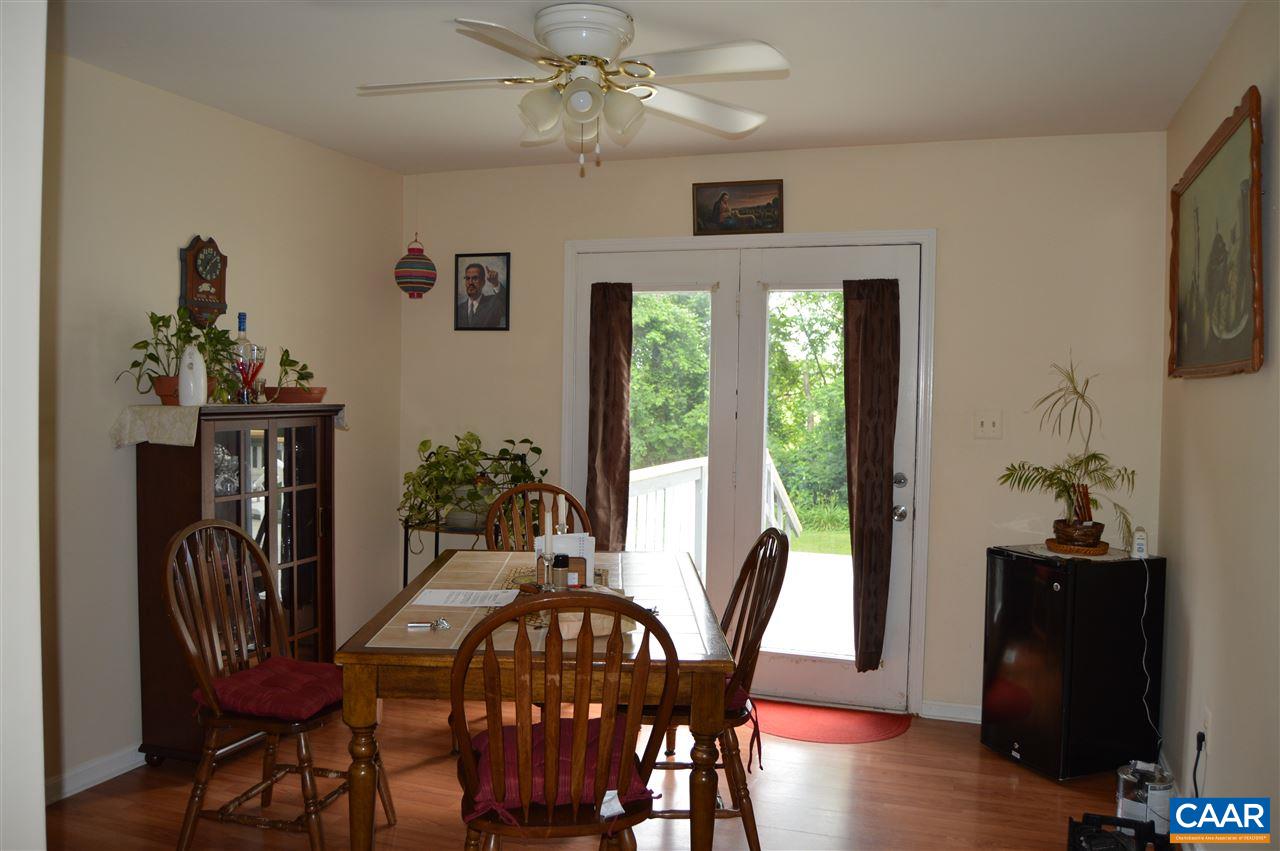 92 Rippin Run Road Ruckersville, VA 22968 - Photo 7 of 17 a view of a dining room with furniture window and wooden floor