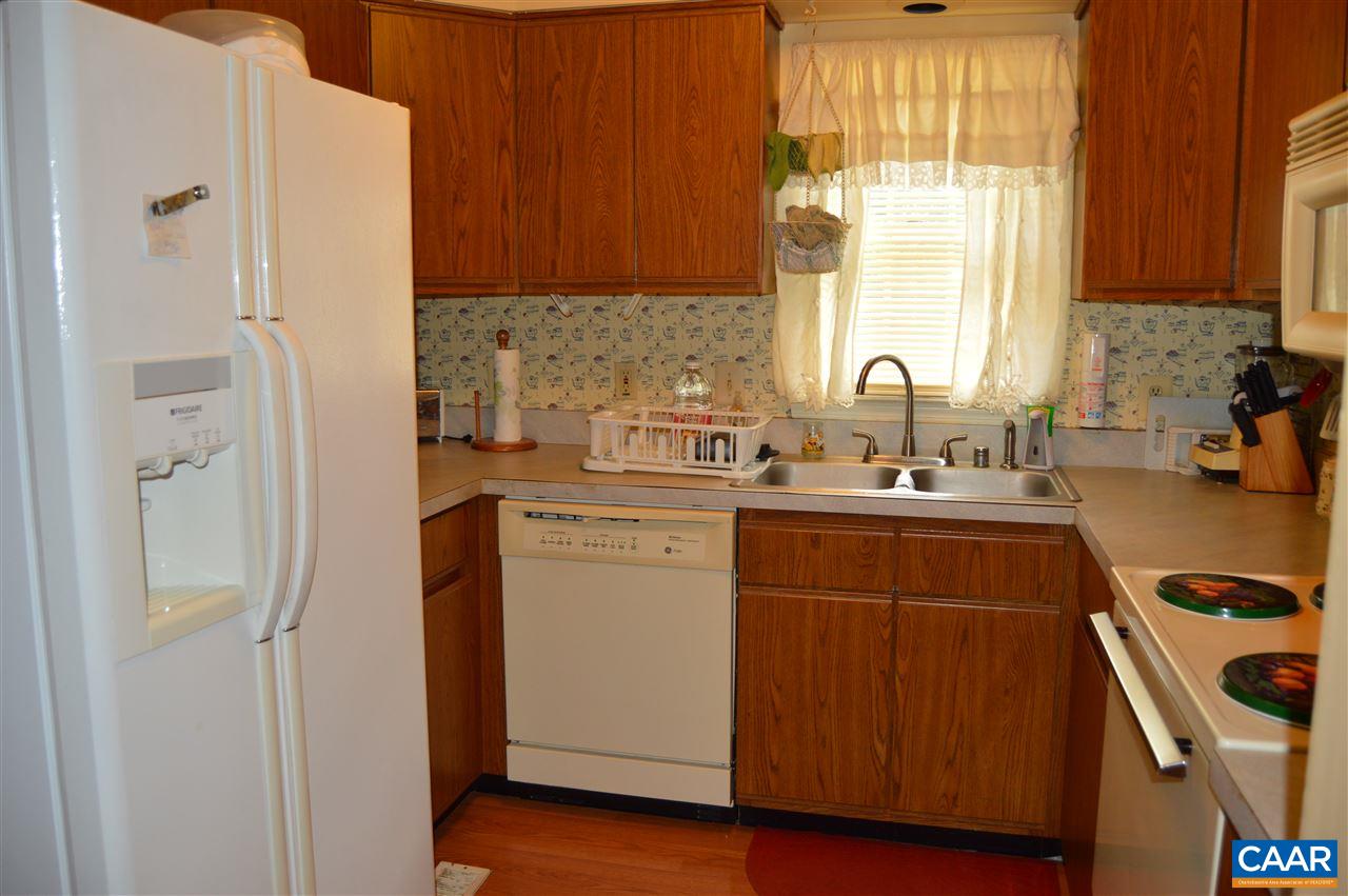 92 Rippin Run Road Ruckersville, VA 22968 - Photo 8 of 17 a kitchen with a sink cabinets and a window