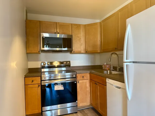 a kitchen with a stove and a microwave