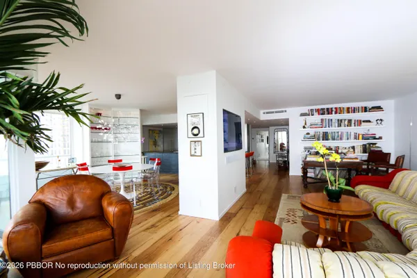 a living room with furniture and a lamp