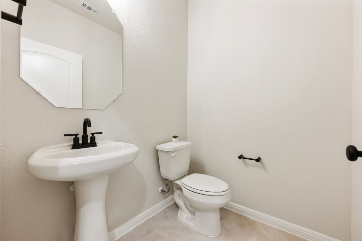 283 Ranier Way Dripping Springs, TX 78620 - Photo 28 of 39 Bathroom featuring baseboards and light tile patterned floors