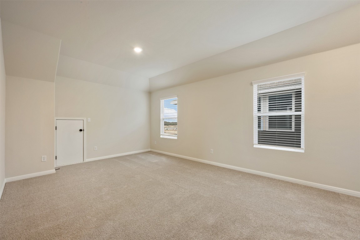 283 Ranier Way Dripping Springs, TX 78620 - Photo 31 of 39 Spare room with light colored carpet and recessed lighting