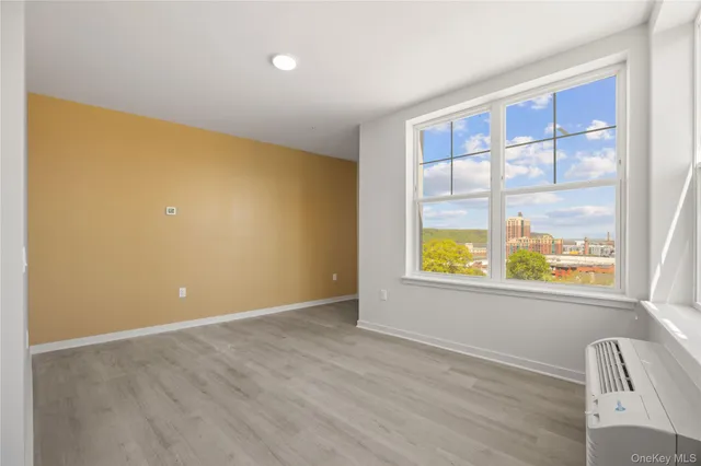 a view of an empty room with a window