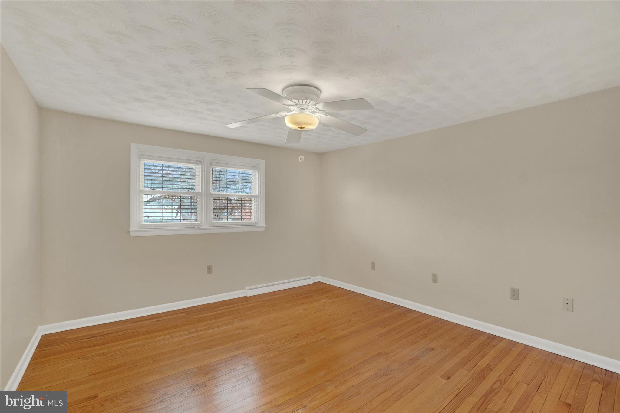 3460 Sycamore Road Dover, PA 17315 - Photo 14 of 28 a view of a room with wooden floor and a ceiling fan