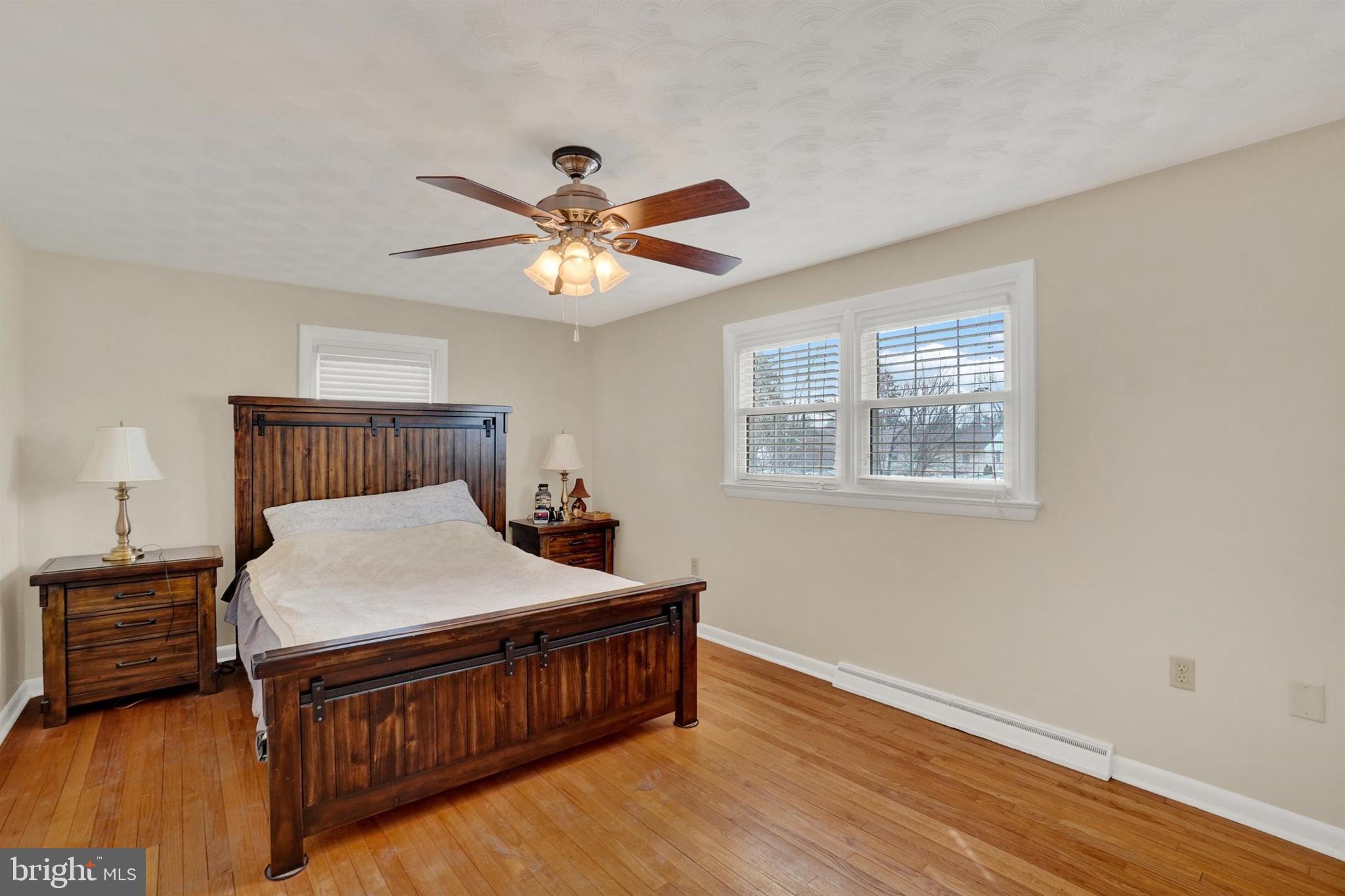 3460 Sycamore Road Dover, PA 17315 - Photo 18 of 28 a bedroom with a bed a window and a chandelier