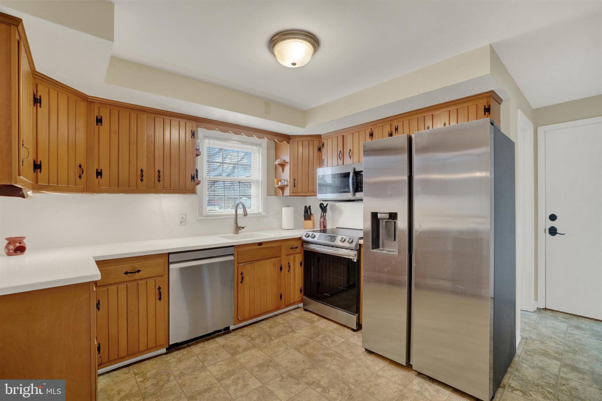 3460 Sycamore Road Dover, PA 17315 - Photo 8 of 28 a kitchen with stainless steel appliances granite countertop a refrigerator a sink and dishwasher