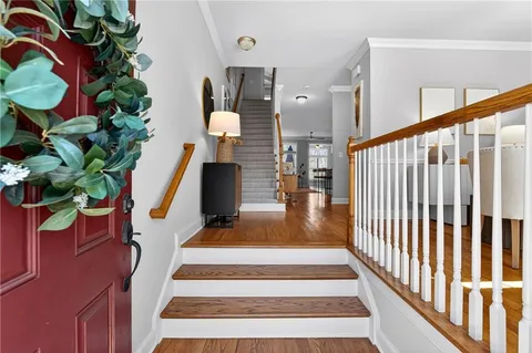 a view of entryway with wooden floor
