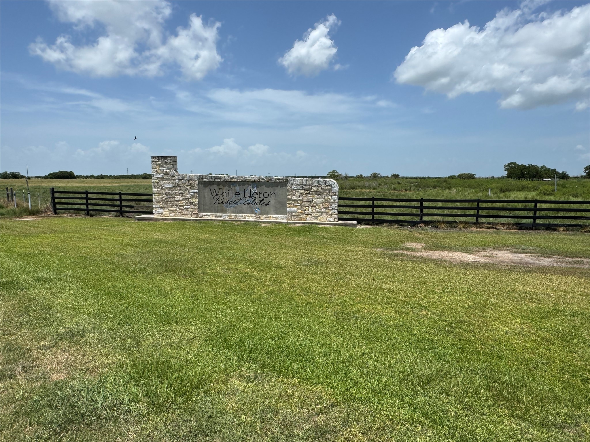 12-2 & 11 2 Smith Loop Anahuac, TX 77514 - Photo 4 of 10 a view of a lake with a city