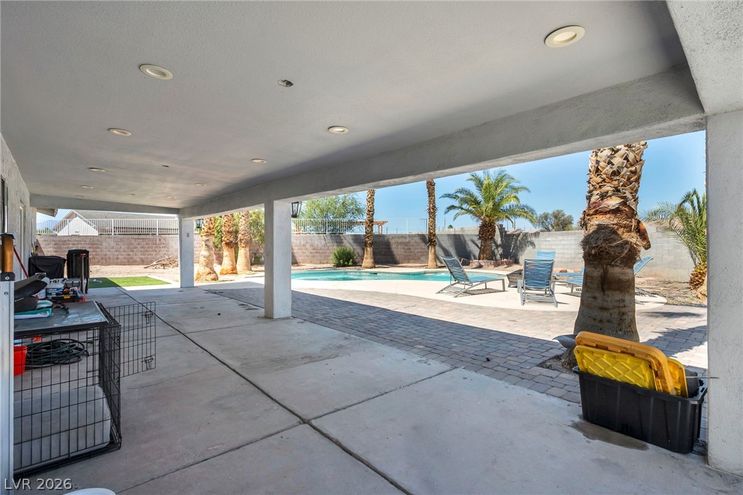 5882 Rio Tinto Way Las Vegas, NV 89110 - Photo 47 of 56 A spacious covered patio provides a shaded oasis overlooking the refreshing pool and sun-drenched yard.