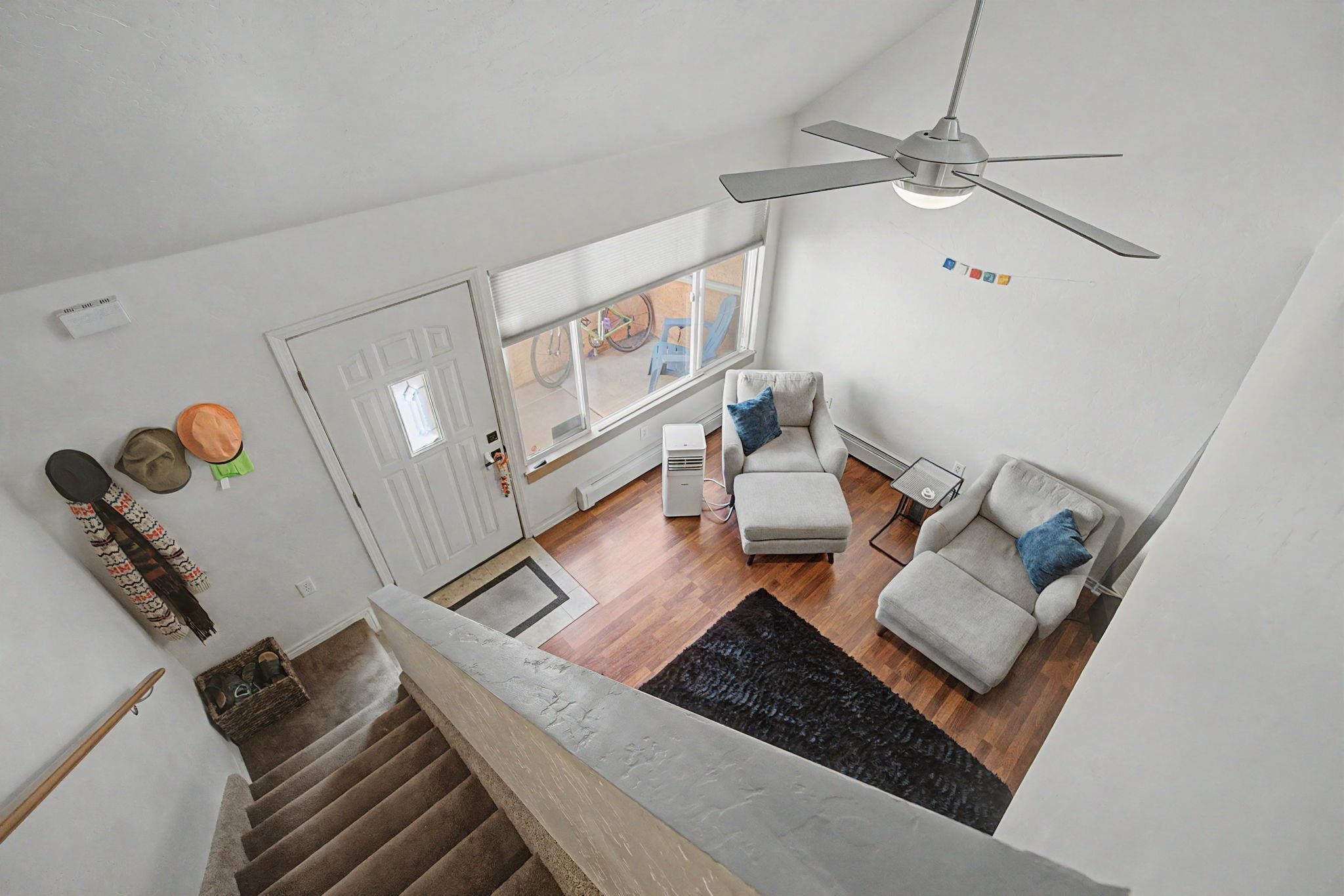 948 Northern Way, Unit 4 Grand Junction, CO 81506 - Photo 11 of 14 a living room with furniture and a chandelier