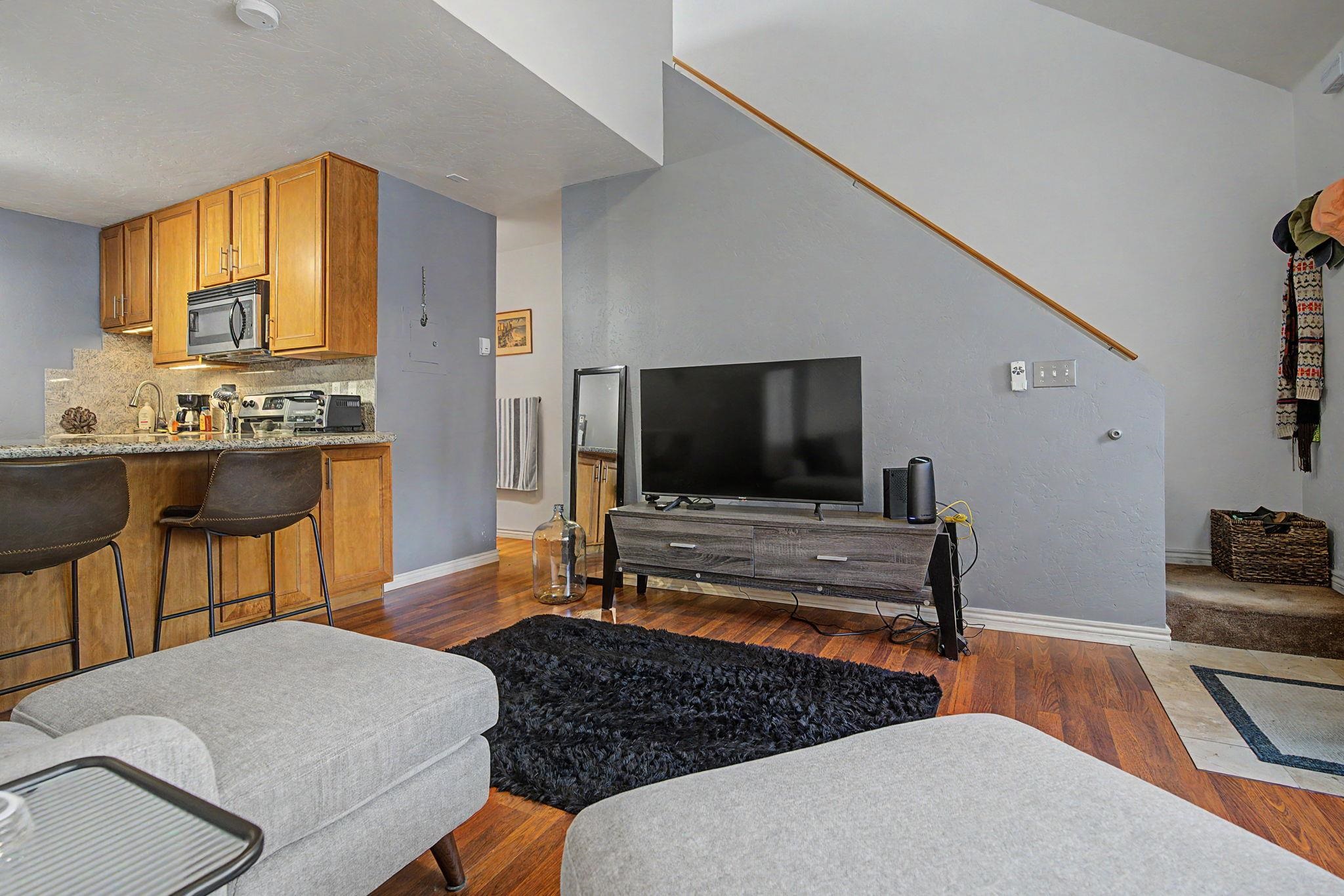 948 Northern Way, Unit 4 Grand Junction, CO 81506 - Photo 12 of 14 a living room with furniture and a flat screen tv