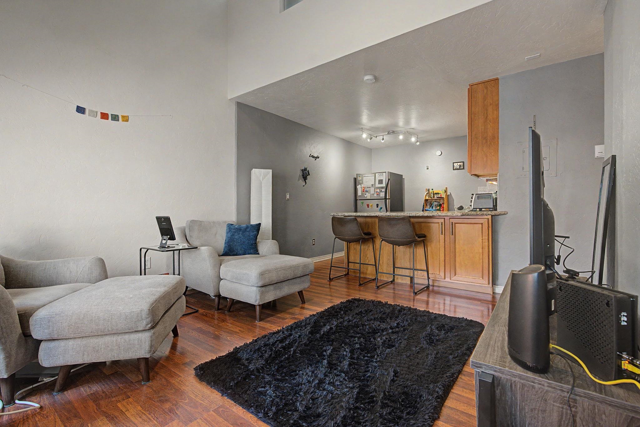 948 Northern Way, Unit 4 Grand Junction, CO 81506 - Photo 13 of 14 a living room with furniture and a flat screen tv