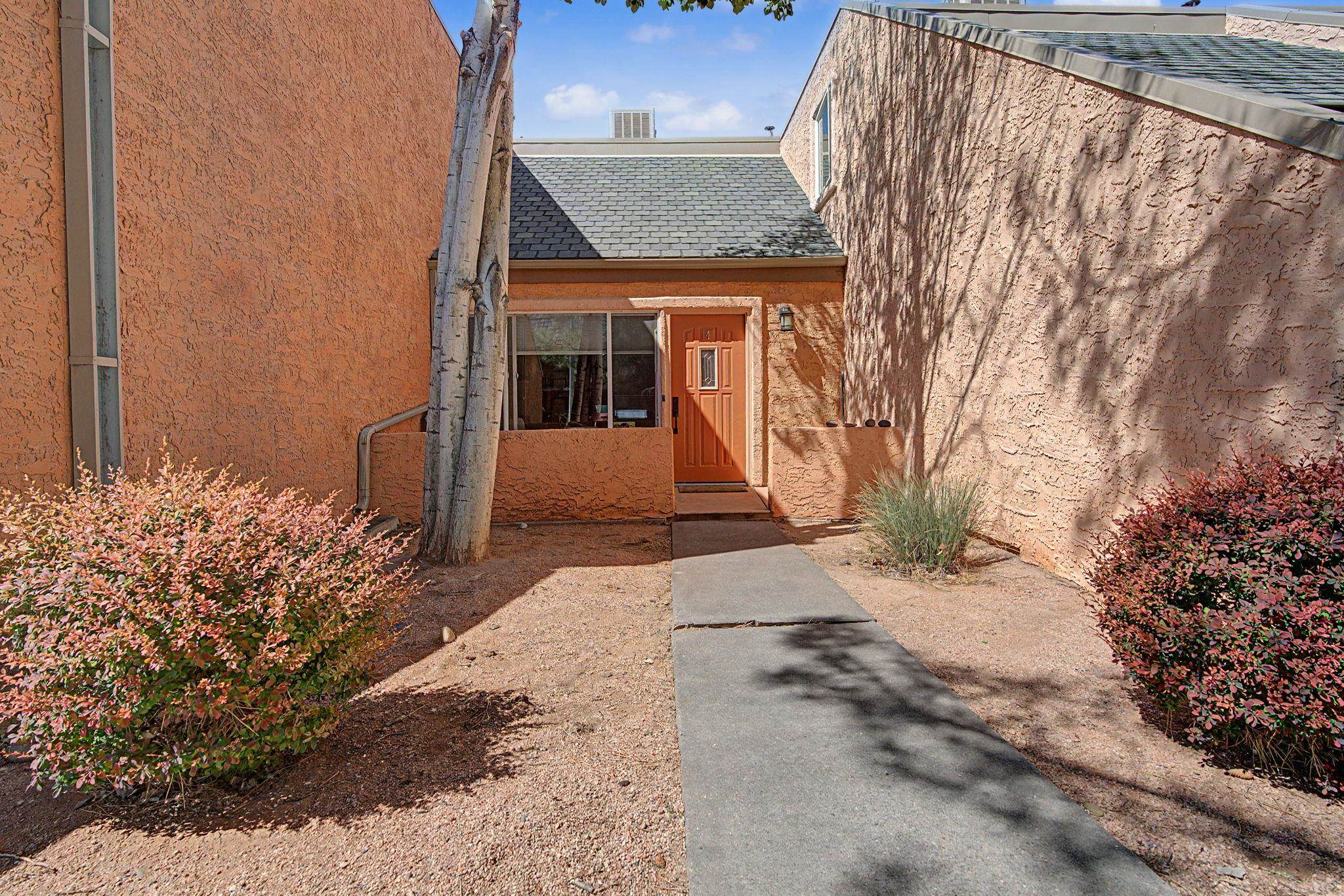 948 Northern Way, Unit 4 Grand Junction, CO 81506 - Photo 2 of 14 a view of a brick house with a yard