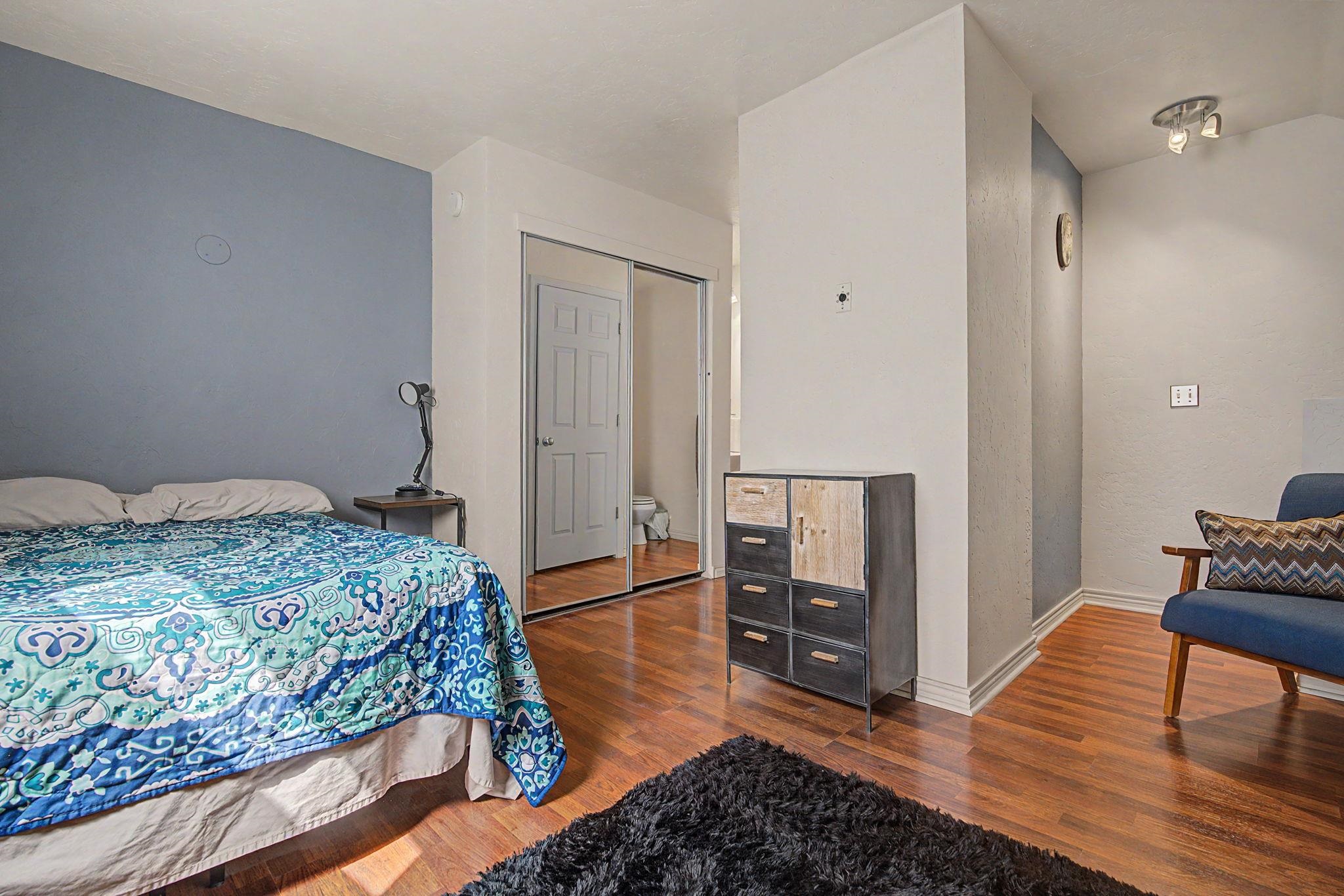 948 Northern Way, Unit 4 Grand Junction, CO 81506 - Photo 6 of 14 a bedroom with a bed and wooden floor
