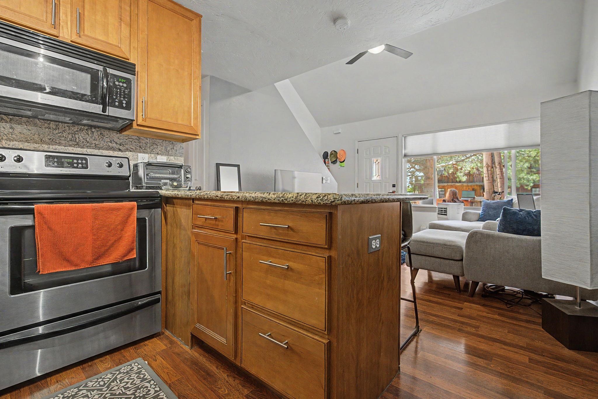 948 Northern Way, Unit 4 Grand Junction, CO 81506 - Photo 10 of 14 a dining hall with stainless steel appliances granite countertop a stove and a refrigerator