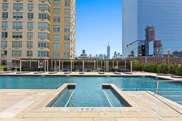 a view of a patio with couches and a table and chairs