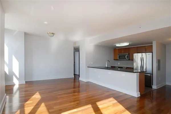 a kitchen with stainless steel appliances a refrigerator and a stove