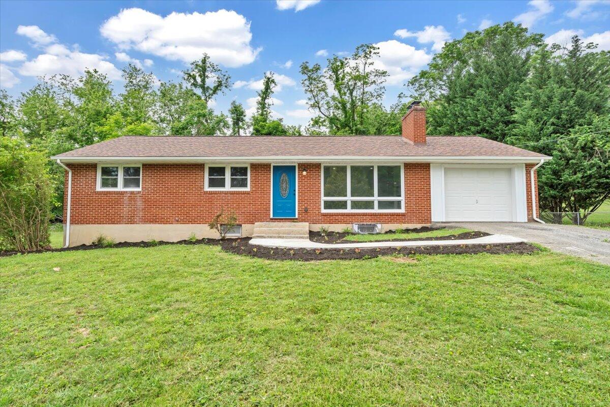 233 Oak Drive Blue Ridge, VA 24064 - Photo 1 of 37 a front view of house with yard and green space