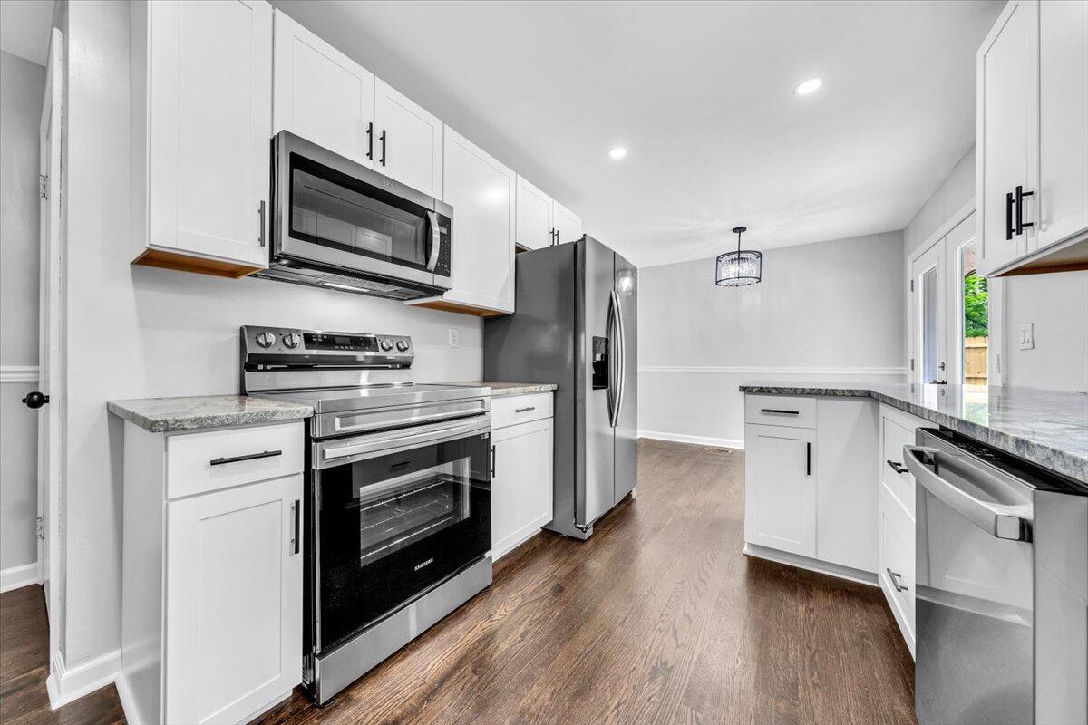 233 Oak Drive Blue Ridge, VA 24064 - Photo 11 of 37 a kitchen with stainless steel appliances a stove microwave and a refrigerator