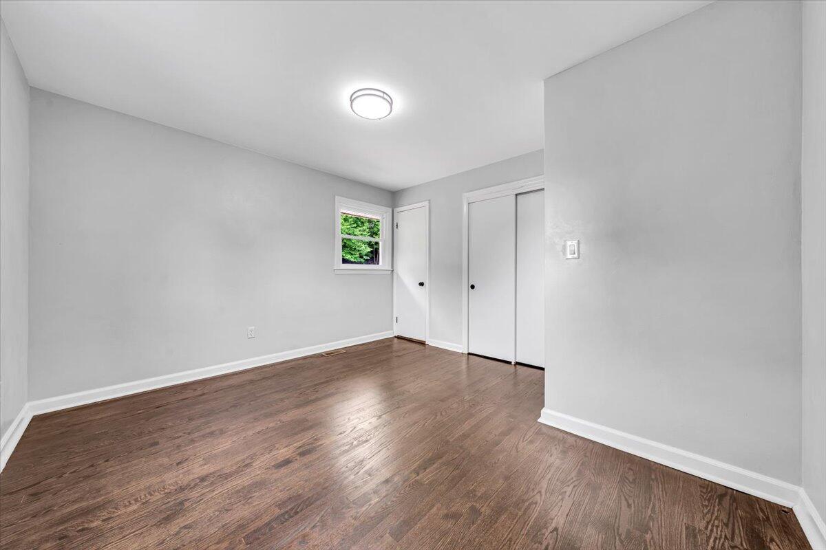 233 Oak Drive Blue Ridge, VA 24064 - Photo 15 of 37 an empty room with wooden floor and window