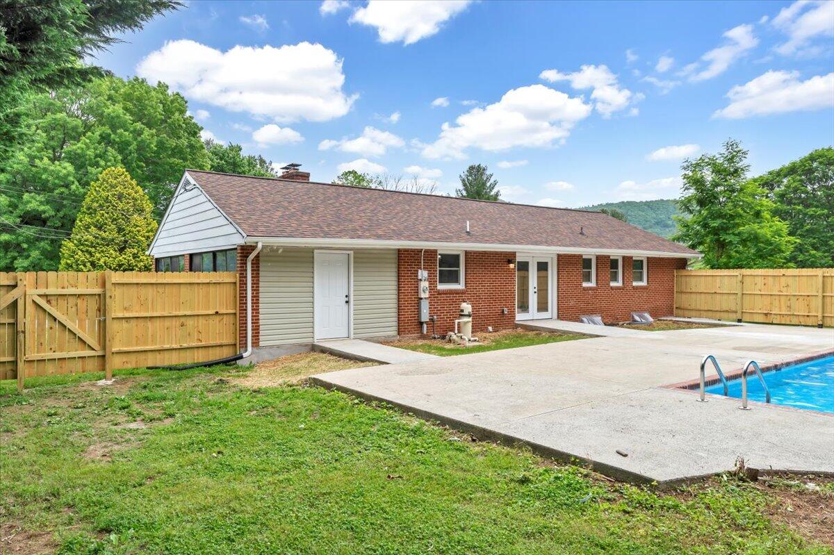 233 Oak Drive Blue Ridge, VA 24064 - Photo 30 of 37 a view of a house with a patio