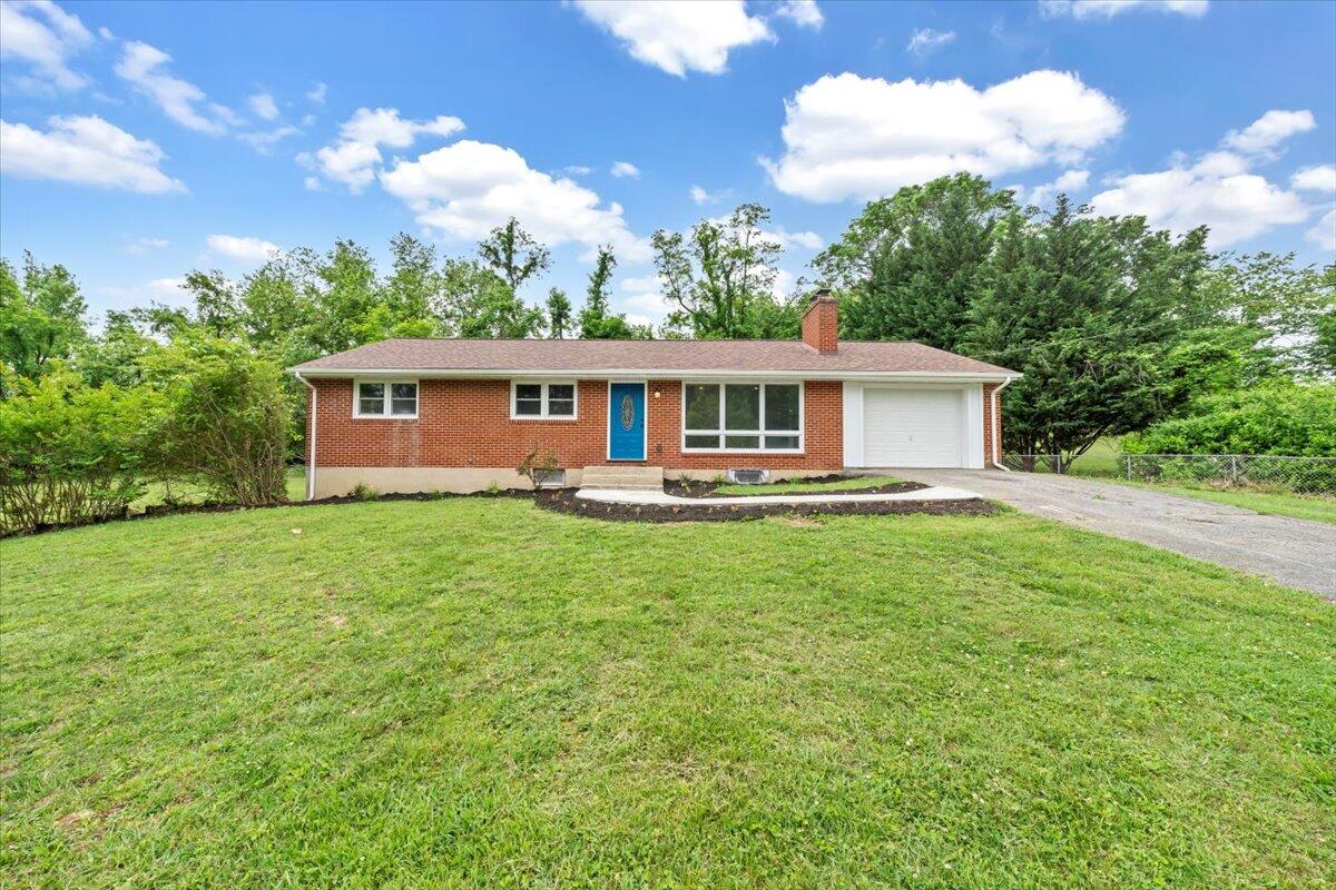 233 Oak Drive Blue Ridge, VA 24064 - Photo 37 of 37 a front view of a house with yard and green space