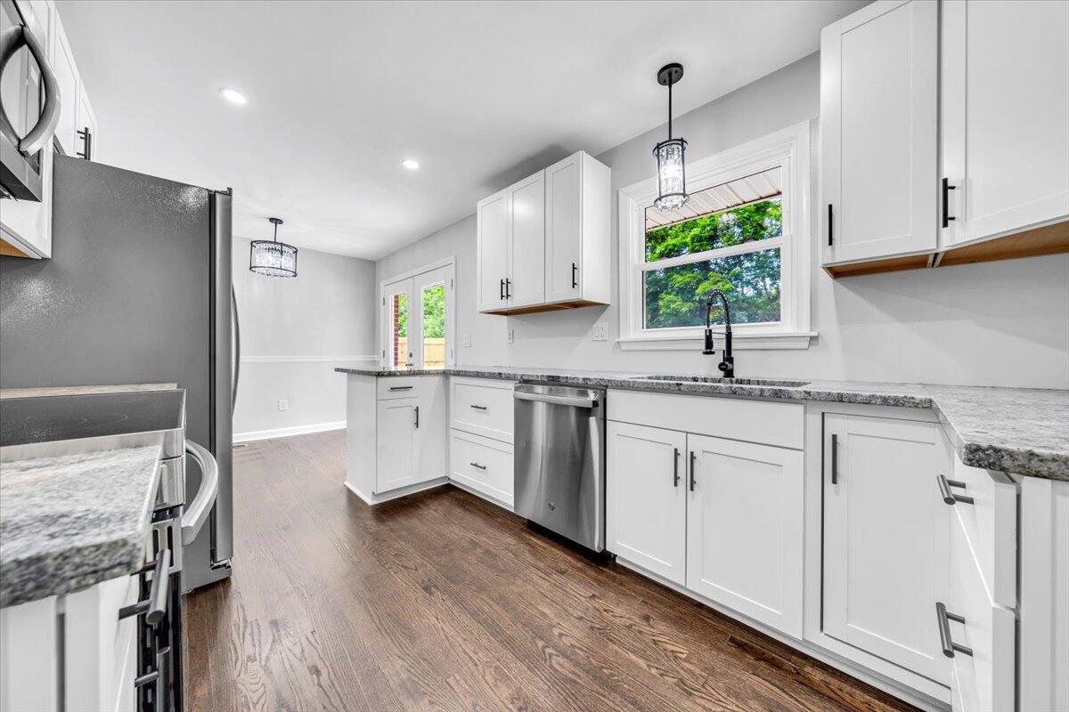 233 Oak Drive Blue Ridge, VA 24064 - Photo 9 of 37 a kitchen with granite countertop white cabinets white appliances and sink