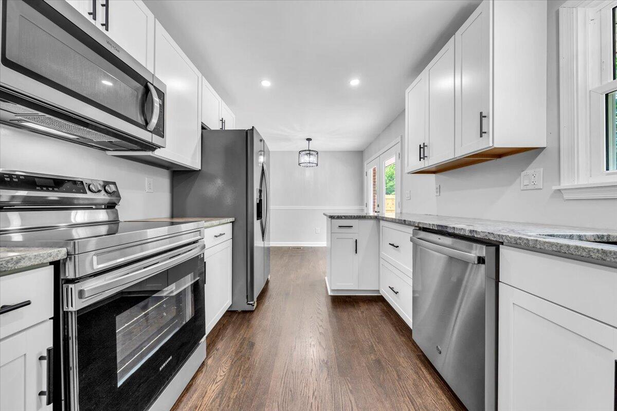 233 Oak Drive Blue Ridge, VA 24064 - Photo 10 of 37 a kitchen with stainless steel appliances granite countertop a stove a sink and a refrigerator