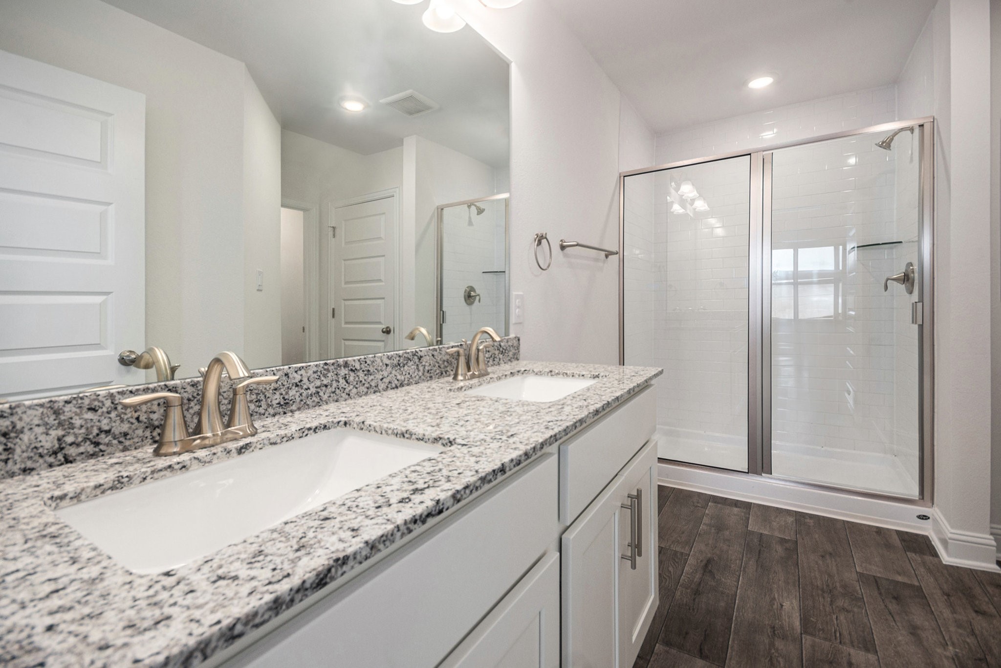 204 Bryan Way Angleton, TX 77515 - Photo 12 of 19 a bathroom with a granite countertop sink and a mirror