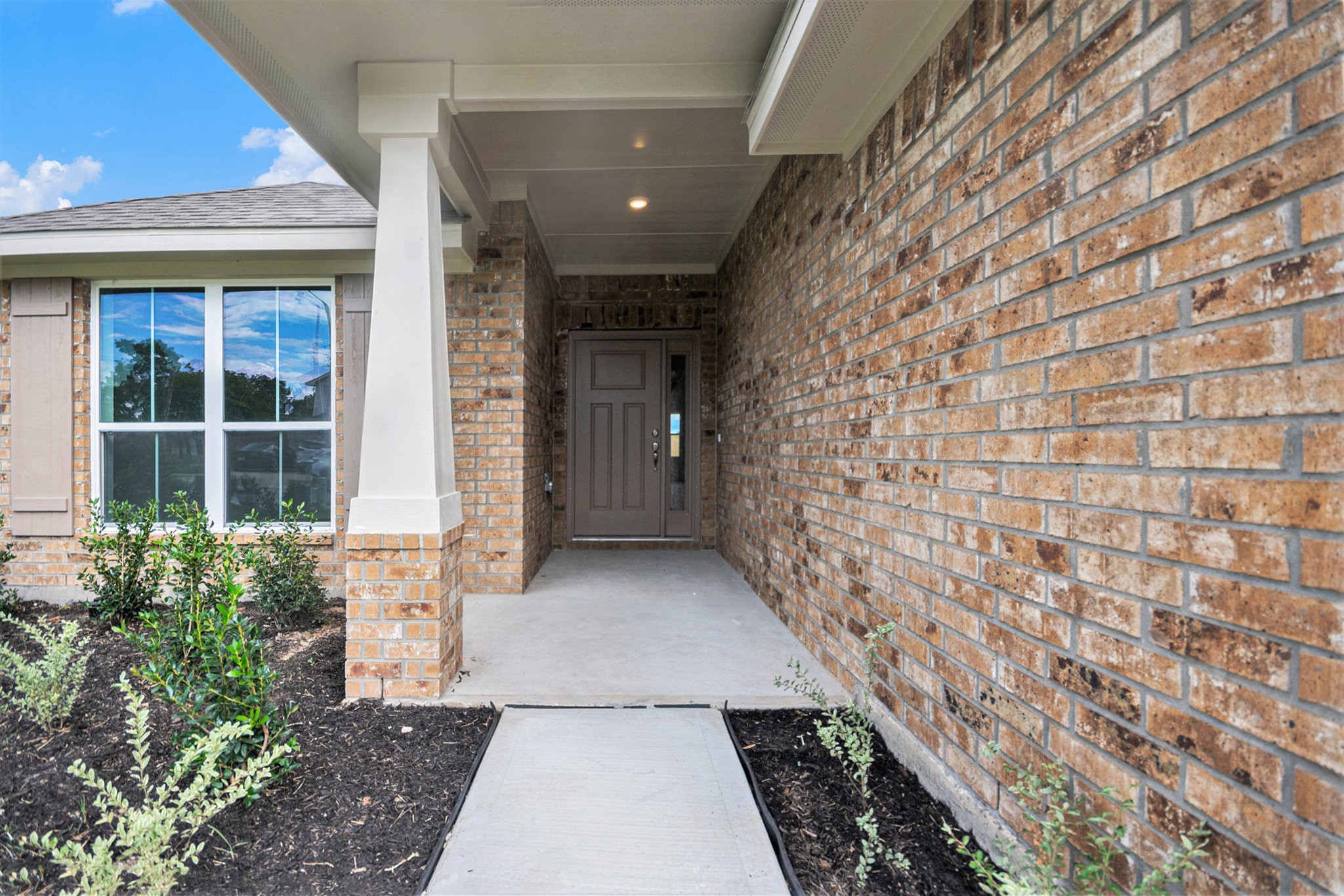 204 Bryan Way Angleton, TX 77515 - Photo 4 of 19 a view of a brick house with a large window