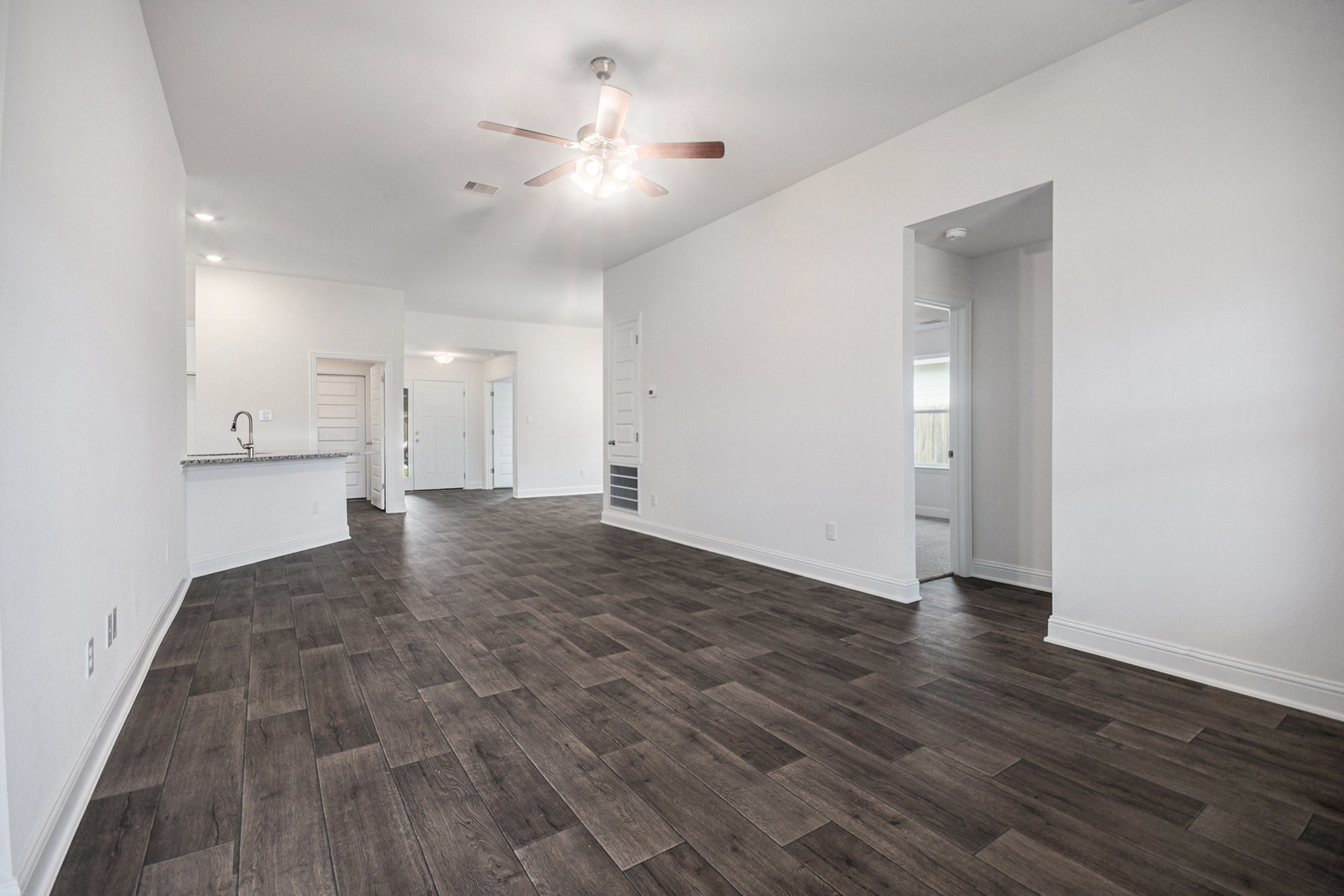 204 Bryan Way Angleton, TX 77515 - Photo 7 of 19 a view of empty room with wooden floor