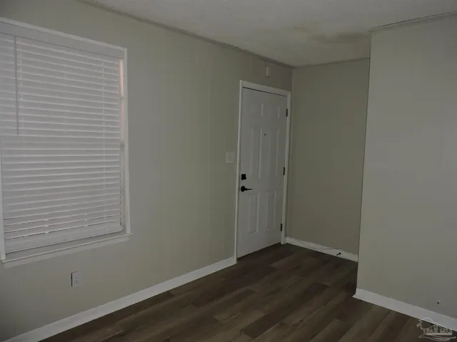 a view of small space with wooden floor