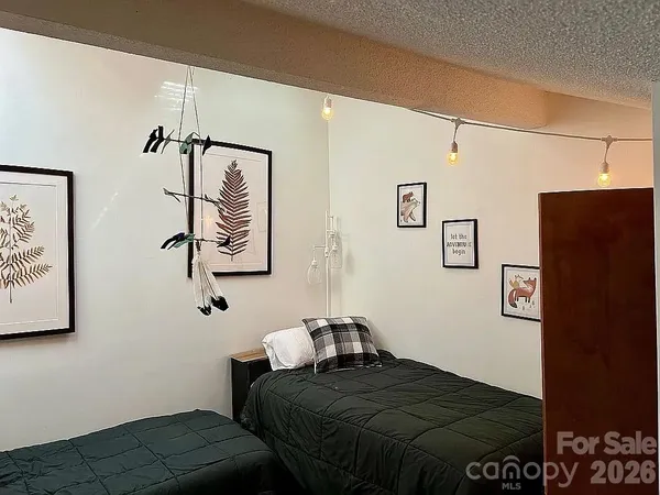 a bedroom with a bed and cabinets