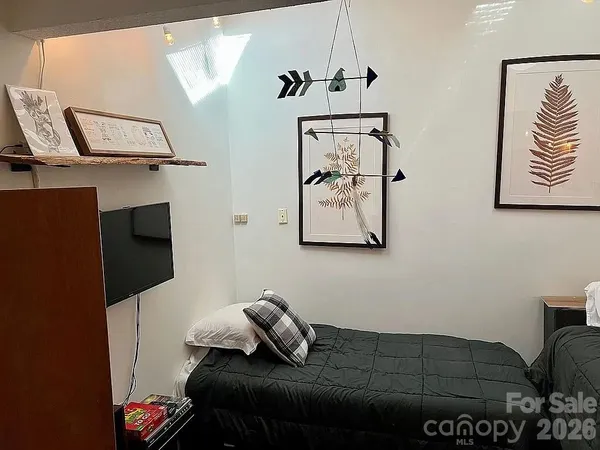 a bedroom with a bed and furniture