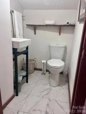 a bathroom with a toilet and a sink